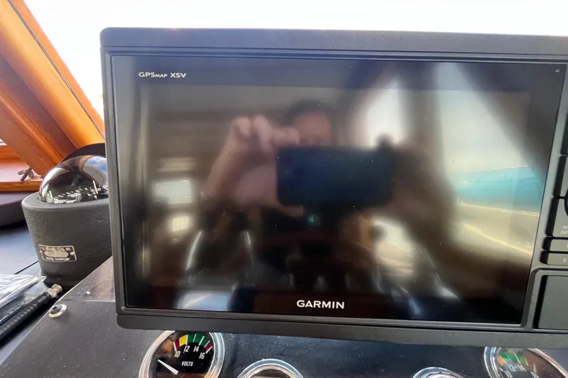 Slide: The Image of Garmin GPS display on 1978 Marine Trader 40 boat dashboard. - 41