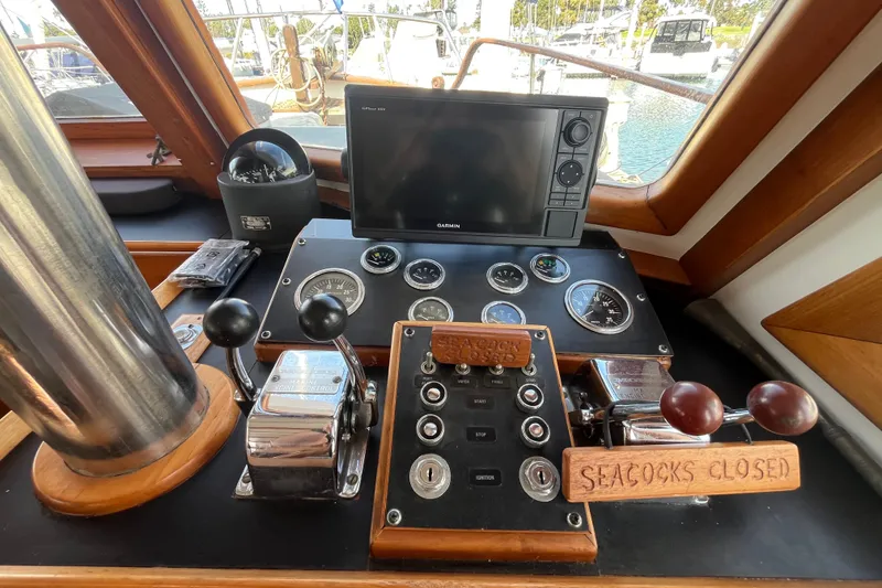 Slide: The Image of Helm of 1978 Marine Trader 40 with navigation equipment and controls. - 42