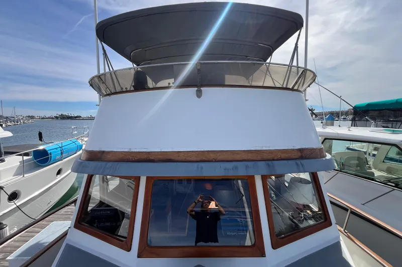 Slide: The Image of 1978 Marine Trader 40 boat docked at marina under clear sky. - 5
