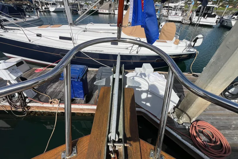 Slide: The Image of 1978 Marine Trader 40 yacht docked at marina, featuring polished railings and nautical equipment. - 7