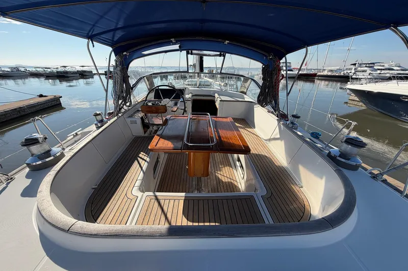 Slide: The Image of Luxurious 2004 Beneteau 57 sailboat with spacious cockpit and elegant wood finish. - 22