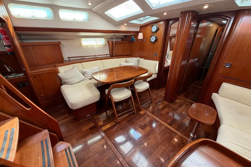 Slide: The Image of Luxurious interior of a 2004 Beneteau 57 yacht with elegant wood finishes. - 41
