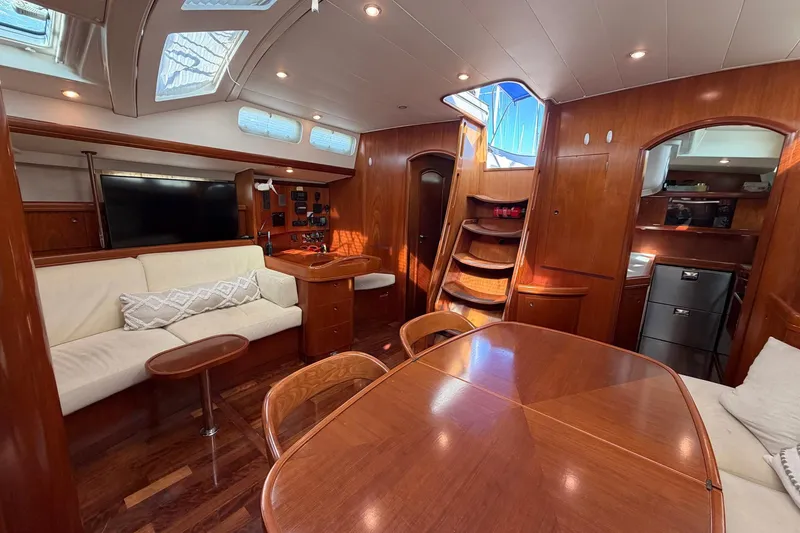 Slide: The Image of Luxurious interior of 2004 Beneteau 57 yacht with elegant wood finish and modern amenities. - 42