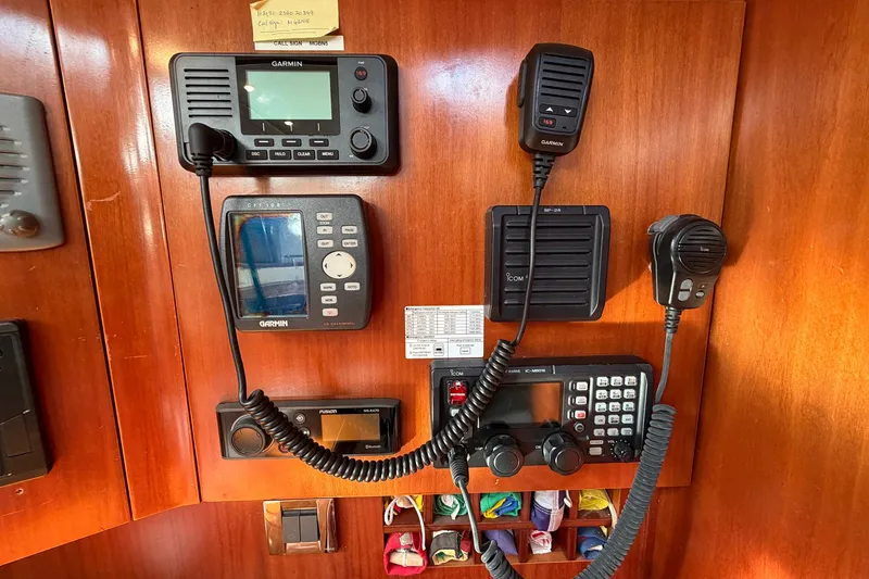 Slide: The Image of Control panel of a 2004 Beneteau 57 yacht with communication equipment. - 75