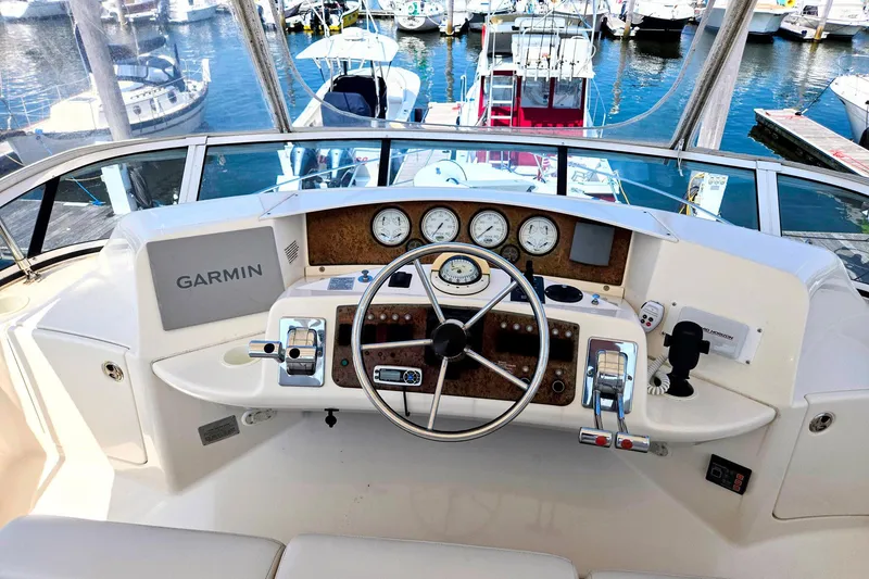 Slide: The Image of Helm of 2003 Silverton 392 Motor Yacht with Garmin navigation, docked at marina. - 18