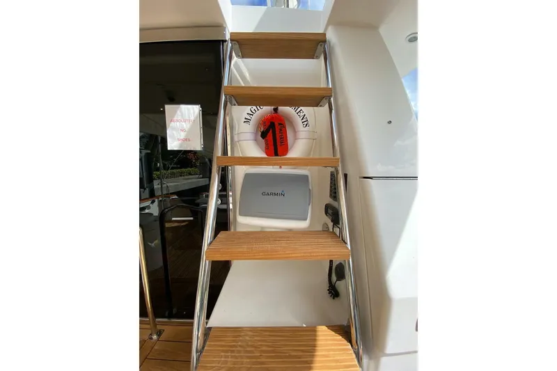 Slide: The Image of Staircase on 2006 North Star Yachts 73 Cockpit Motoryacht with safety equipment. - 12