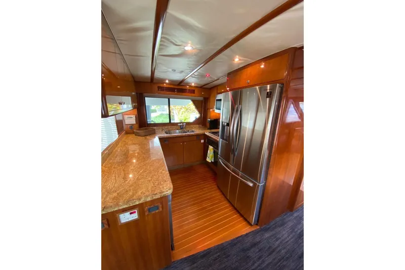 Slide: The Image of Luxurious kitchen interior of 2006 North Star Yachts 73 Cockpit Motoryacht with stainless steel appliances. - 14