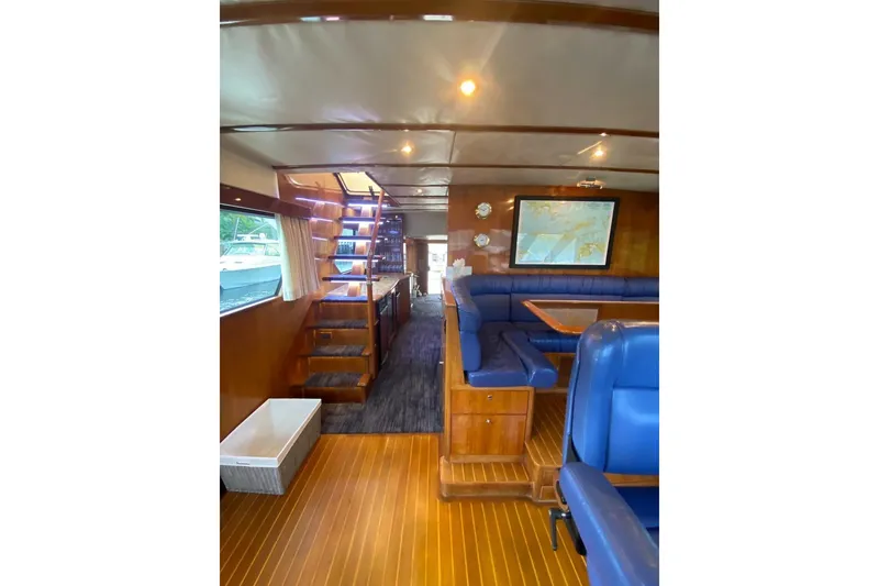 Slide: The Image of Luxurious interior of 2006 North Star Yachts 73 Cockpit Motoryacht with elegant wood and blue seating. - 17