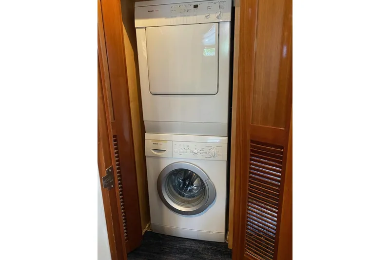 Slide: The Image of Stacked washer and dryer in 2006 North Star Yachts 73 Cockpit Motoryacht laundry area. - 18