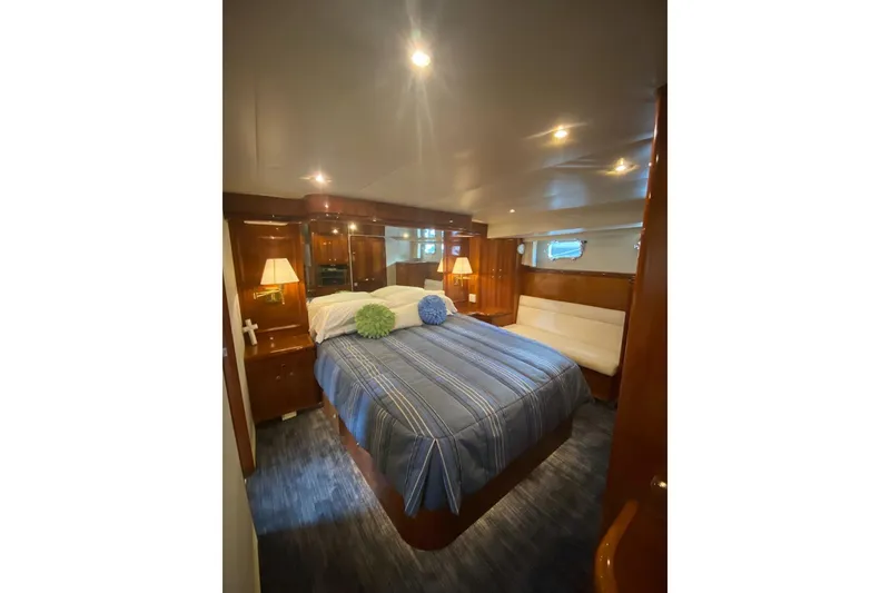 Slide: The Image of Luxurious bedroom interior of 2006 North Star Yachts 73 Cockpit Motoryacht with elegant wood finishes. - 20