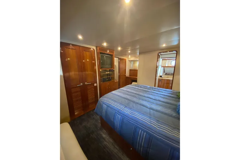 Slide: The Image of Luxurious bedroom interior of 2006 North Star Yachts 73 Cockpit Motoryacht with wood finishes. - 21