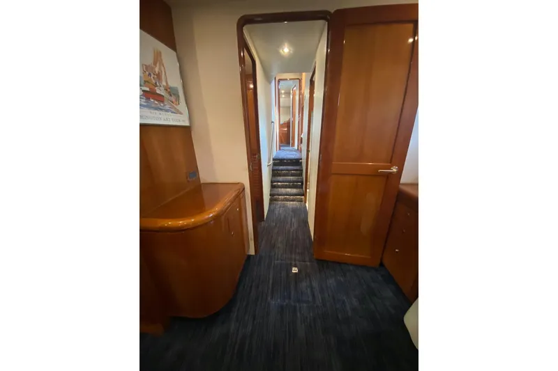 Slide: The Image of Interior hallway of 2006 North Star Yachts 73 Cockpit Motoryacht with wooden cabinetry. - 27