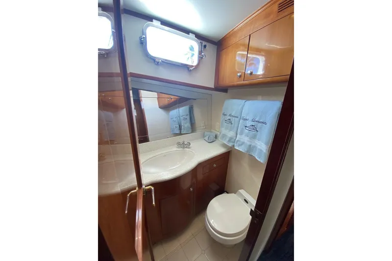 Slide: The Image of Luxurious bathroom in 2006 North Star Yachts 73 Cockpit Motoryacht with elegant wood cabinetry. - 28