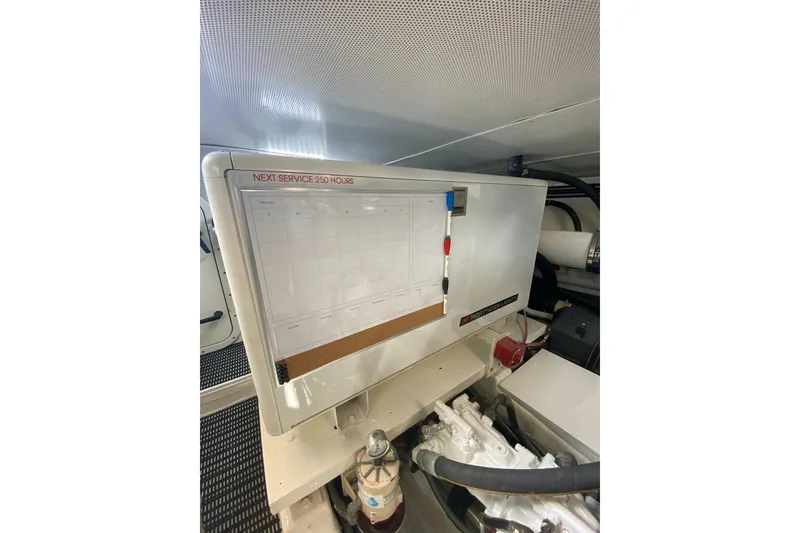 Slide: The Image of Engine room of 2006 North Star Yachts 73 Cockpit Motoryacht with service schedule board. - 35