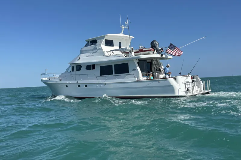 Slide: The Image of 2006 North Star Yachts 73 Cockpit Motoryacht cruising on open water under clear skies. - 4
