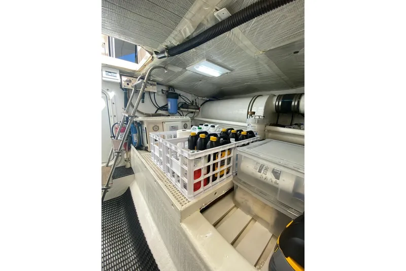Slide: The Image of Engine room of 2006 North Star Yachts 73 Cockpit Motoryacht with storage containers. - 41