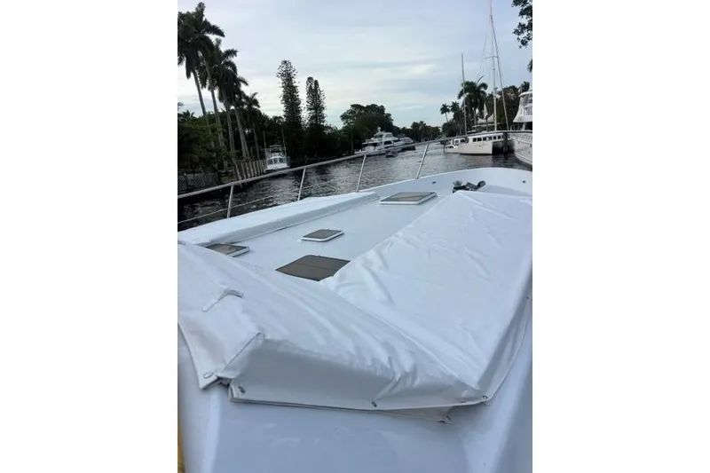 Slide: The Image of 2006 North Star Yachts 73 Cockpit Motoryacht deck view with palm trees and waterway. - 45