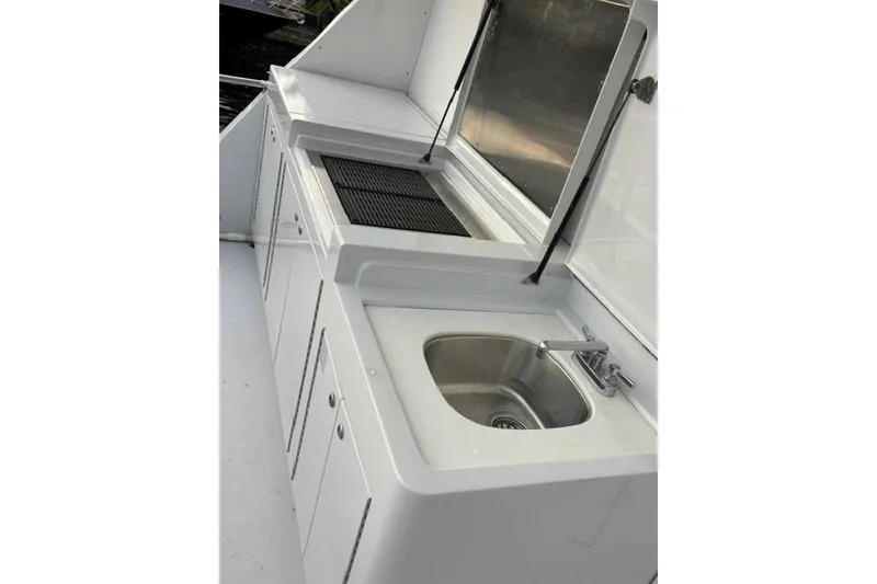 Slide: The Image of Outdoor kitchen area on a 2006 North Star Yachts 73 Cockpit Motoryacht. - 49