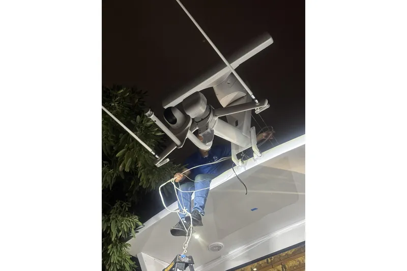 Slide: The Image of Person working on yacht antenna at night, North Star Yachts 73 Cockpit Motoryacht, 2006. - 5