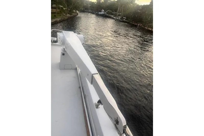 Slide: The Image of Side view of 2006 North Star Yachts 73 Cockpit Motoryacht on a calm waterway. - 52