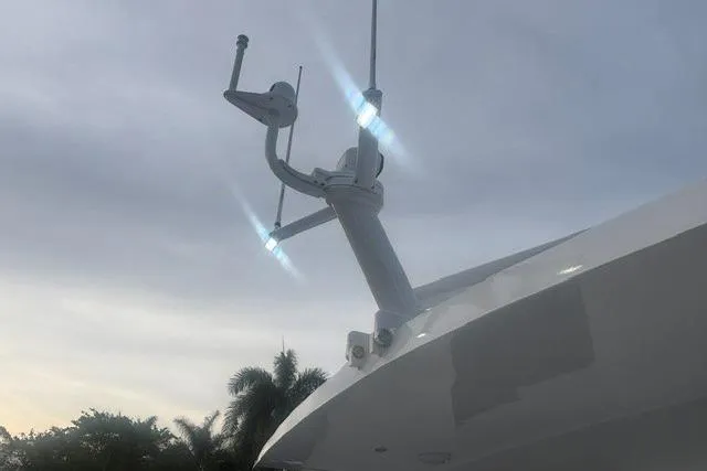 Slide: The Image of Radar equipment on a 2006 North Star Yachts 73 Cockpit Motoryacht against a cloudy sky. - 54