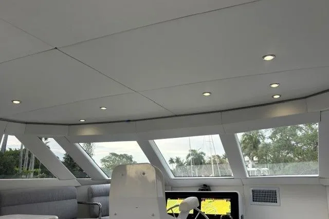 Slide: The Image of Interior view of 2006 North Star Yachts 73 Cockpit Motoryacht with modern seating and windows. - 56