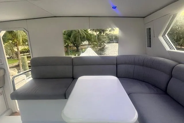 Slide: The Image of Luxurious interior of 2006 North Star Yachts 73 Cockpit Motoryacht with plush seating and table. - 61