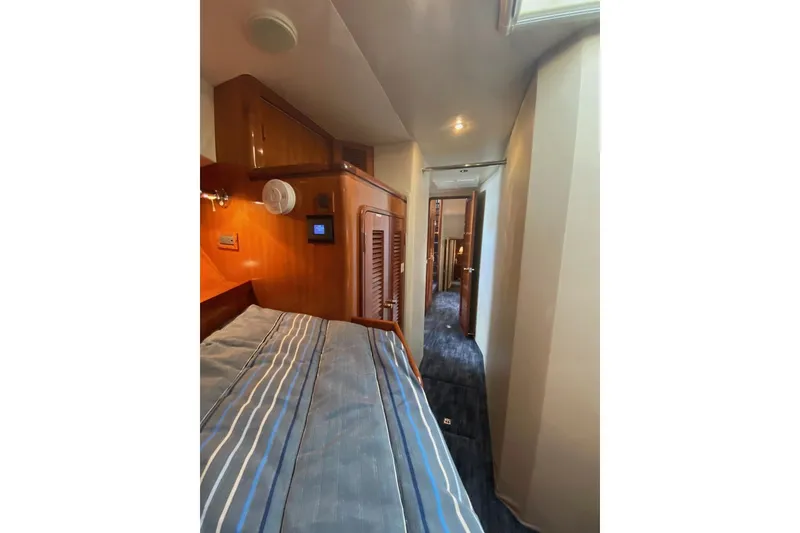 Slide: The Image of Interior of 2006 North Star Yachts 73 Cockpit Motoryacht, featuring cozy cabin and hallway. - 8