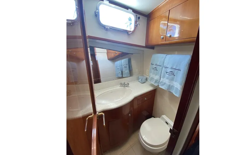 Slide: The Image of Luxurious bathroom in 2006 North Star Yachts 73 Cockpit Motoryacht with elegant wood cabinetry. - 9