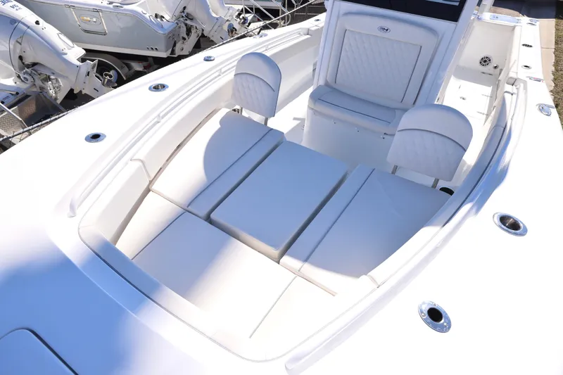 Slide: The Image of 2026 Sea Hunt Gamefish 25 boat interior with cushioned seating and sleek design. - 2