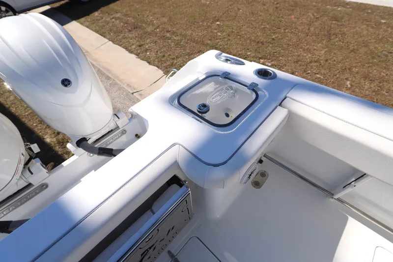 Slide: The Image of 2026 Sea Hunt Gamefish 25 boat interior with dual engines and livewell. - 20