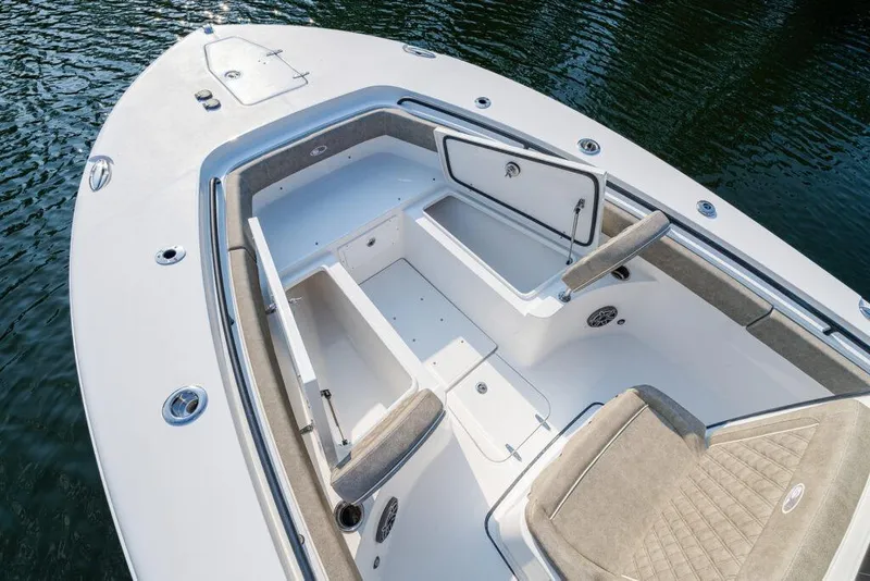 Slide: The Image of Manufacturer Provided Image: 2026 Sea Hunt Gamefish 25 boat interior with open storage compartments and cushioned seating. - 27