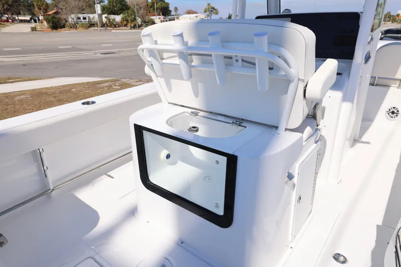Slide: The Image of 2026 Sea Hunt Gamefish 25 boat interior with rod holders and storage compartment. - 5