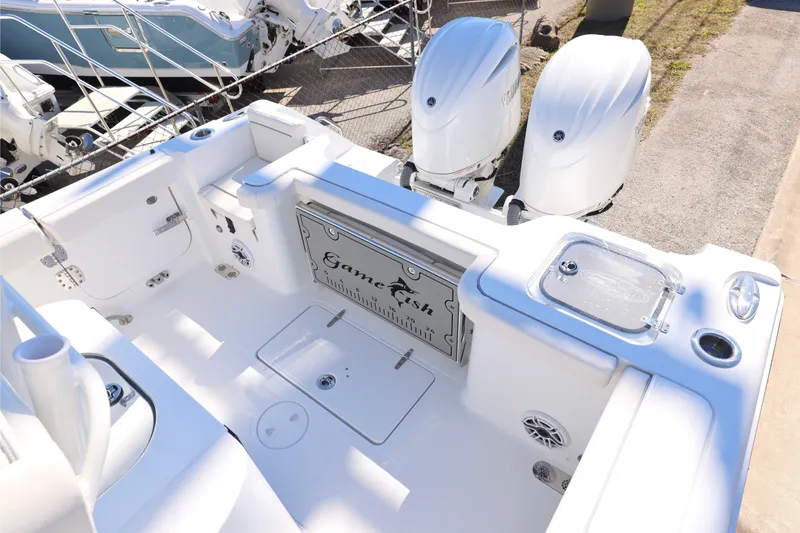 Slide: The Image of 2026 Sea Hunt Gamefish 25 boat interior with dual engines and fishing features. - 7