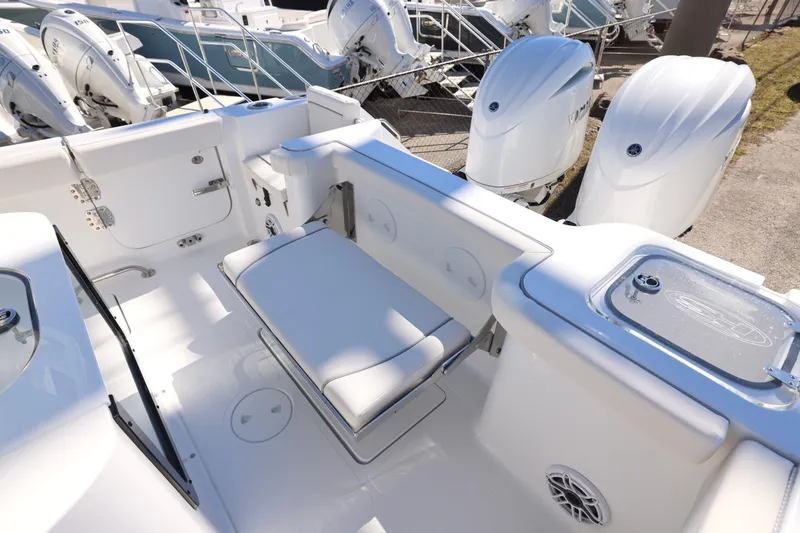 Slide: The Image of 2026 Sea Hunt Gamefish 25 boat interior with seating and outboard motors. - 8