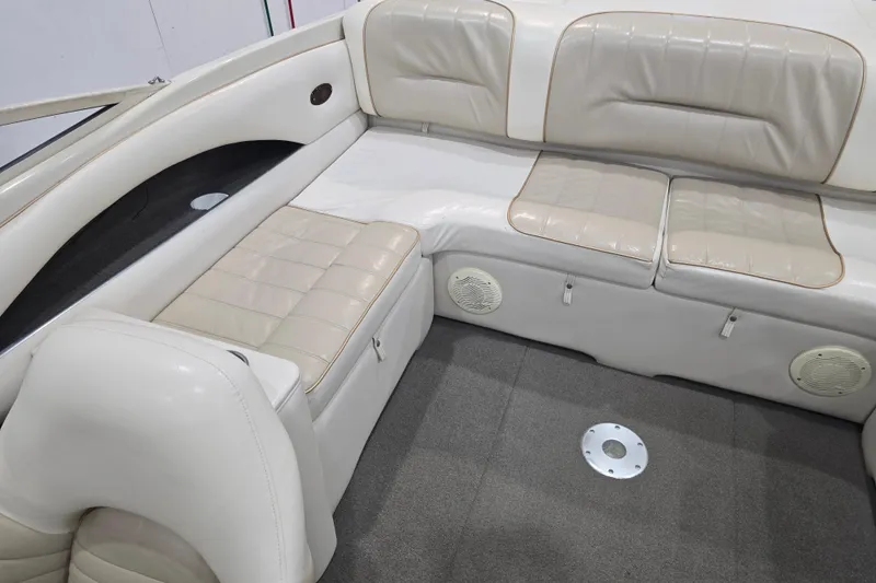 Slide: The Image of Interior of 1996 Larson LXi 218 boat with beige leather seating. - 19