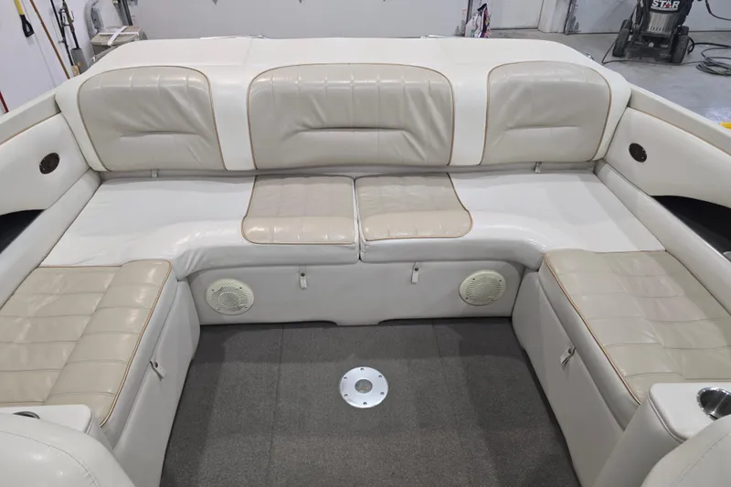Slide: The Image of Interior of a 1996 Larson LXi 218 boat with beige leather seating. - 31