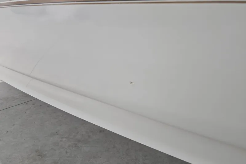 Slide: The Image of 1996 Larson LXi 218 boat hull with minor surface blemish. - 7