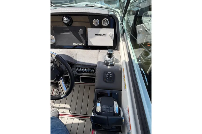 Slide: The Image of 2020 Formula 330 Crossover Bowrider OB dashboard with steering wheel and control panel. - 13