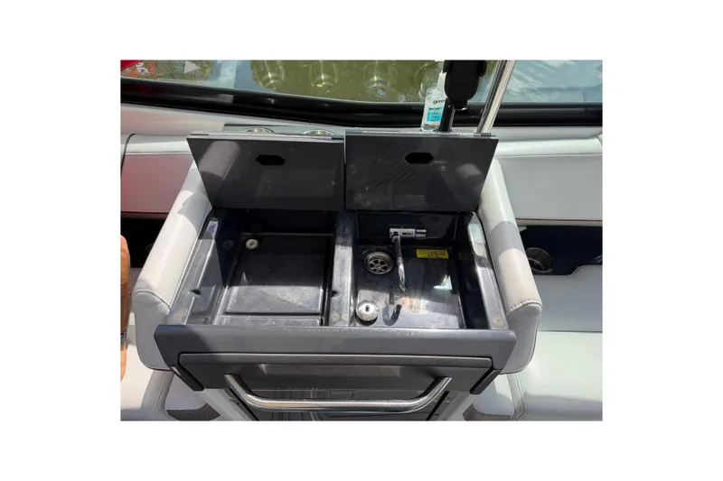Slide: The Image of 2020 Formula 330 Crossover Bowrider OB sink area with open compartments. - 15