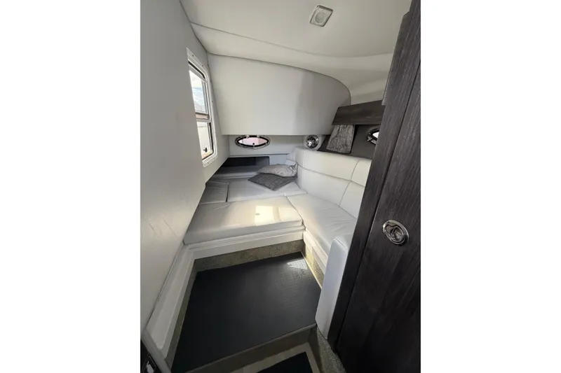 Slide: The Image of 2020 Formula 330 Crossover Bowrider OB cabin interior with white seating and modern design. - 17