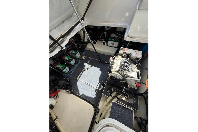 Slide: The Image of Engine compartment of 2020 Formula 330 Crossover Bowrider OB, showcasing mechanical components. - 22