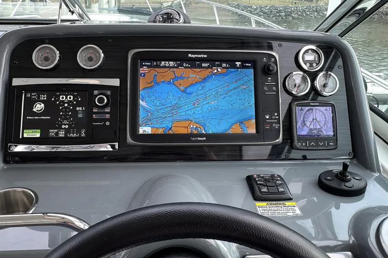 Slide: The Image of Dashboard of a 2016 Formula 34 Performance Cruiser with navigation and control systems. - 13