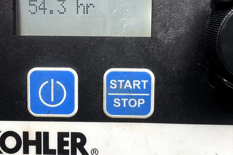 Slide: The Image of Control panel with power and start/stop buttons, Kohler branding, 54.3 hours displayed. - 15