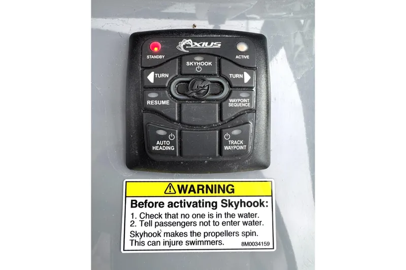 Slide: The Image of Control panel of a 2016 Formula 34 Performance Cruiser with Skyhook warning label. - 16