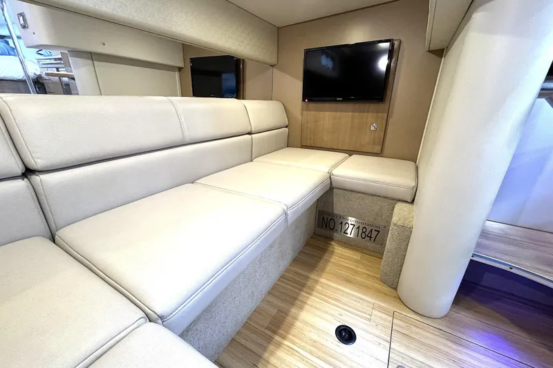 Slide: The Image of Interior of 2016 Formula 34 Performance Cruiser with beige seating and mounted TV. - 21
