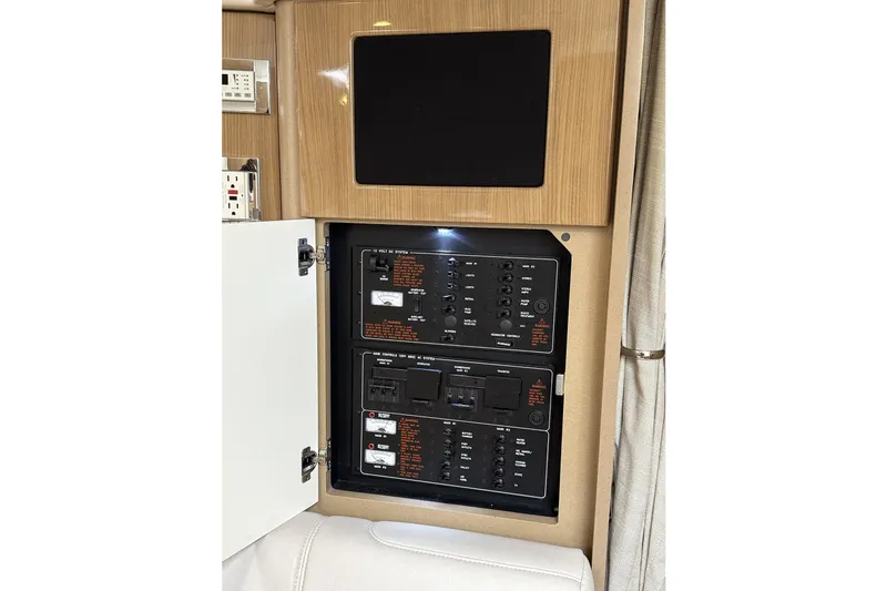 Slide: The Image of 2016 Formula 34 Performance Cruiser electrical panel with open cabinet door. - 33