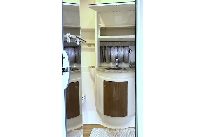 Slide: The Image of 2016 Formula 34 Performance Cruiser bathroom interior with sink and storage. - 38