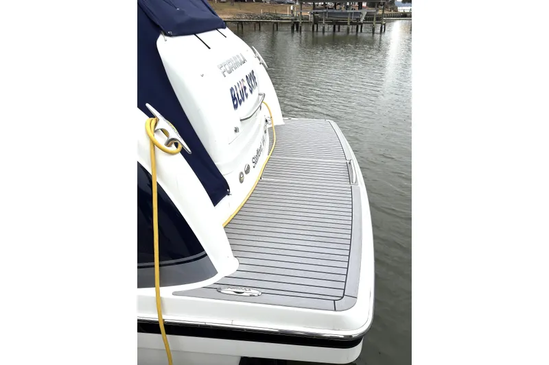 Slide: The Image of 2016 Formula 34 Performance Cruiser docked, featuring a spacious swim platform. - 5