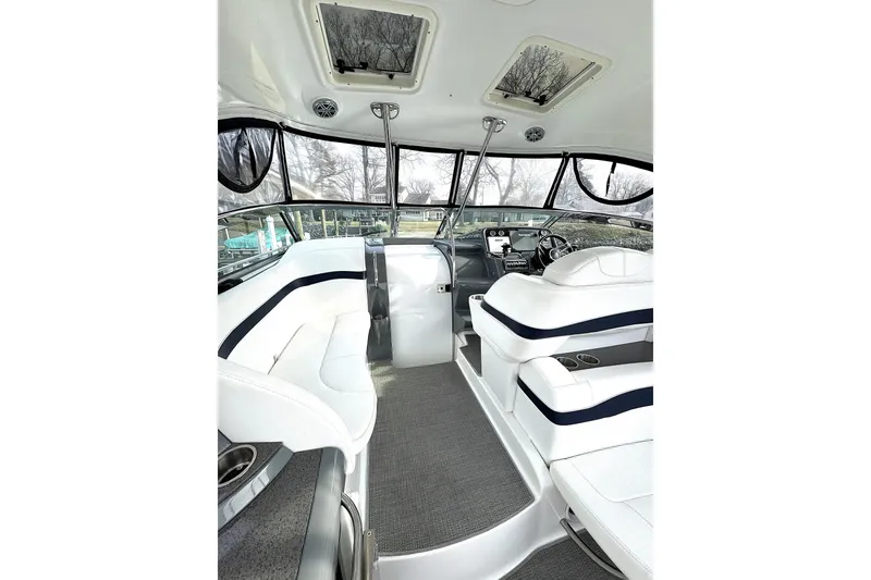 Slide: The Image of 2016 Formula 34 Performance Cruiser interior with white seating and modern helm. - 7